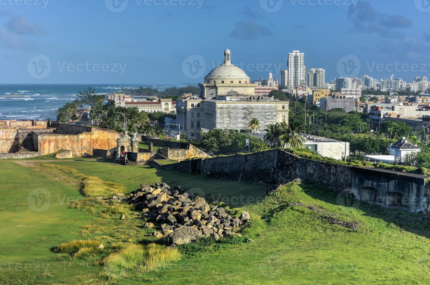 Puerto Rico Capitol and Castillo de San Cristobal, San Juan, Puerto Rico. Castillo de San Cristobal is designated as UNESCO World Heritage Site since 1983. photo
