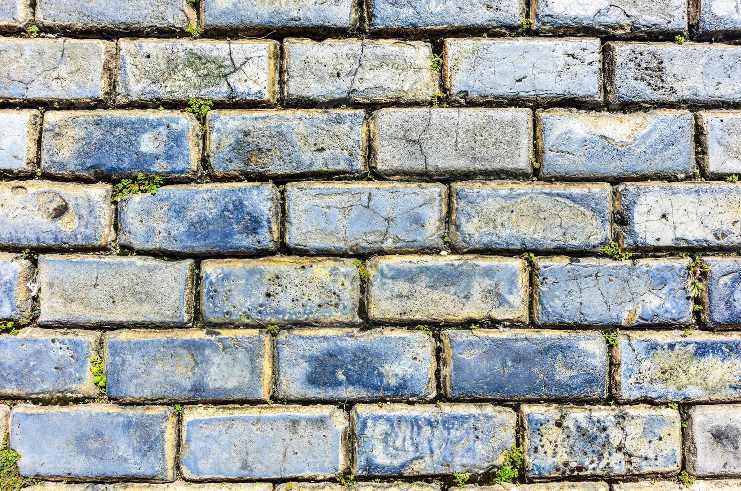 Blue cobblestone paved street in Old San Juan, Puerto Rico. They were brought as ballast in the bottoms of European merchant ships in the 1700s. photo