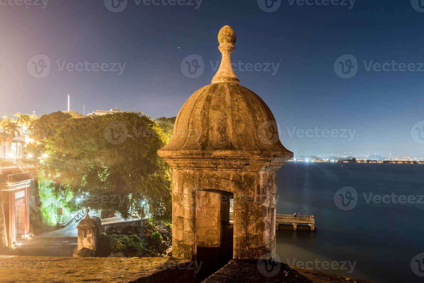 Lookout Tower along the walls of Old San Juan, Puerto Rico from Plaza de la Rogativa with a view of the San Juan Gate. photo