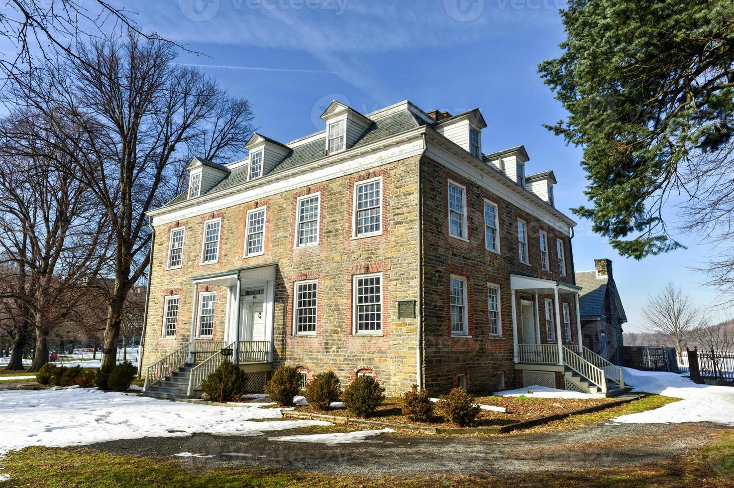 Historic Georgian 1748 Van Cortlandt Manor House built in dressed fieldstone with a double-hipped roof in Bronx, New York photo
