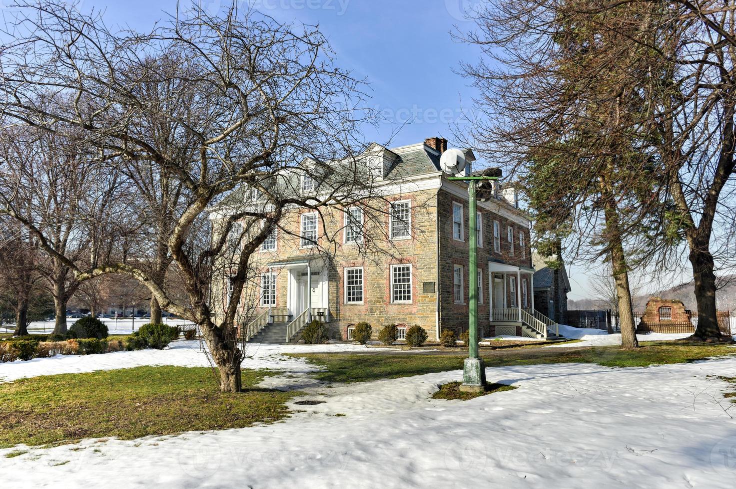 Historic Georgian 1748 Van Cortlandt Manor House built in dressed fieldstone with a double-hipped roof in Bronx, New York photo