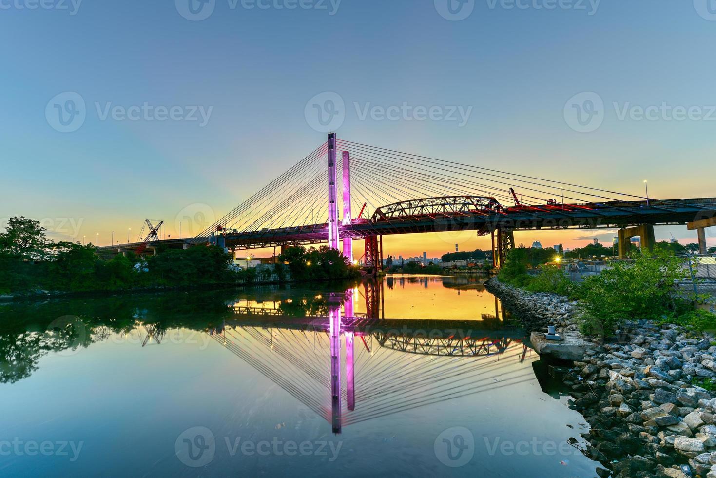 New and old Kosciuszko bridges joining Brooklyn and Queens in New York City across Newtown Creek. The new bridge is a cable-stayed bridge while the old bridge from 1939 is truss bridge. photo