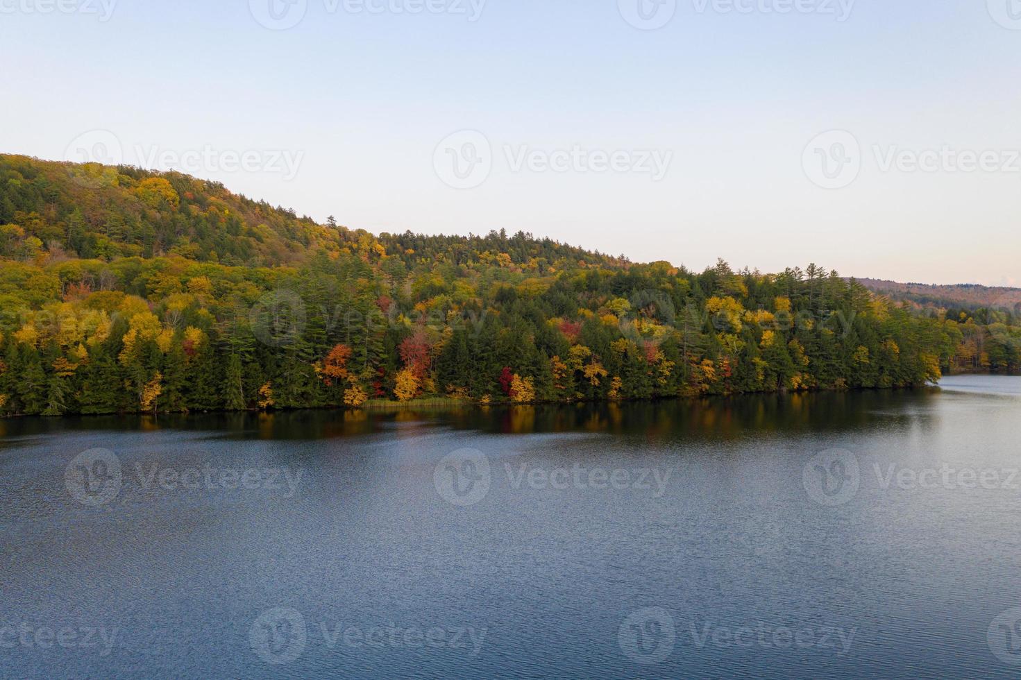 Aerial view of Amherst Lake in fall foliage in Plymouth, Vermont