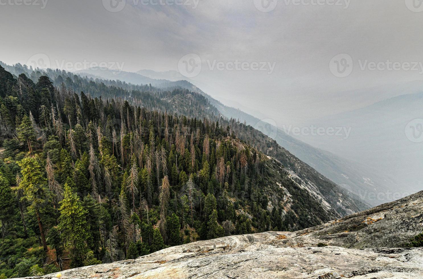 View from Moro Rock at Sequoia National Park with hazy mountains in background following California wildfires. photo