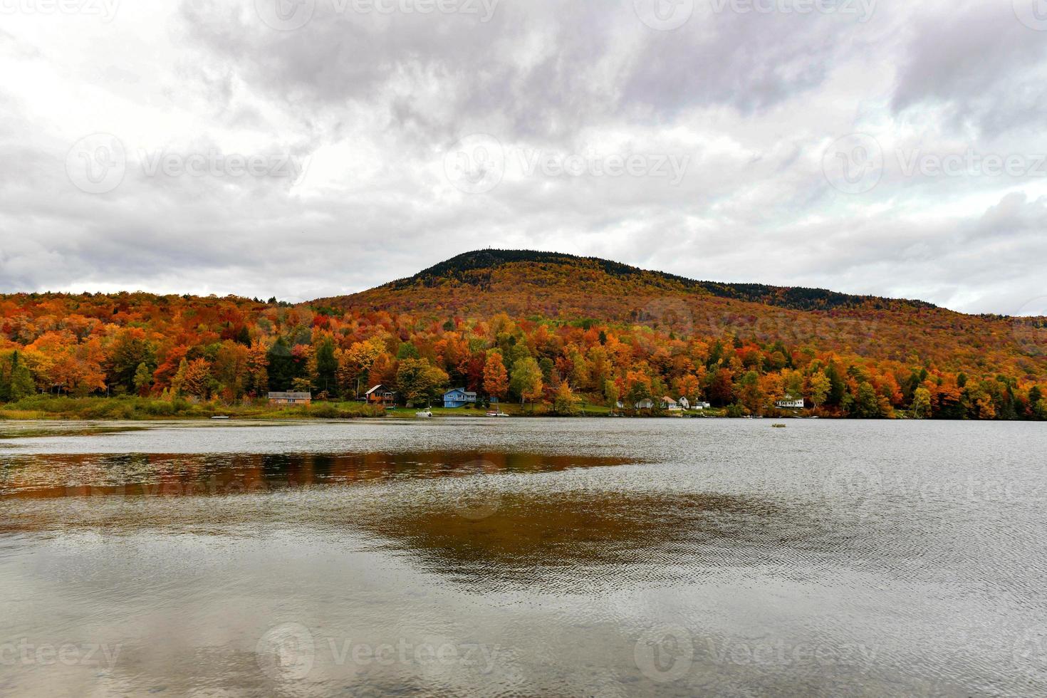 Overlooking of Lake Elmore State Part With Beautiful Autumn Foliage and Water reflections at Elmore, Vermont, USA photo