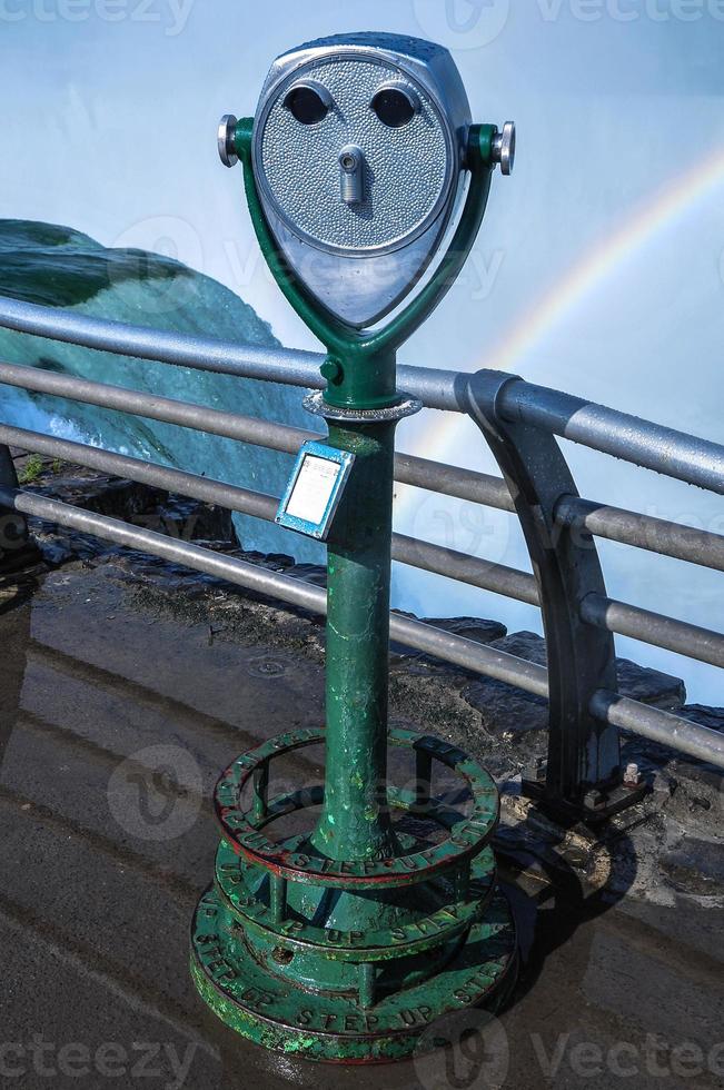 A viewing platform with a view of the falls in the background. photo