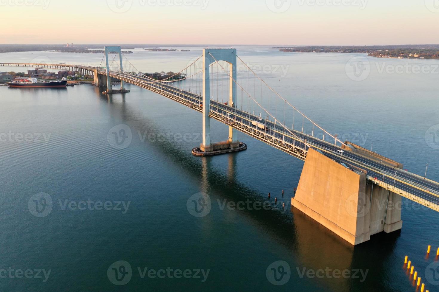 Aerial view of the Throgs Neck Bridge connecting the Bronx with Queens in New York City at sunset. photo