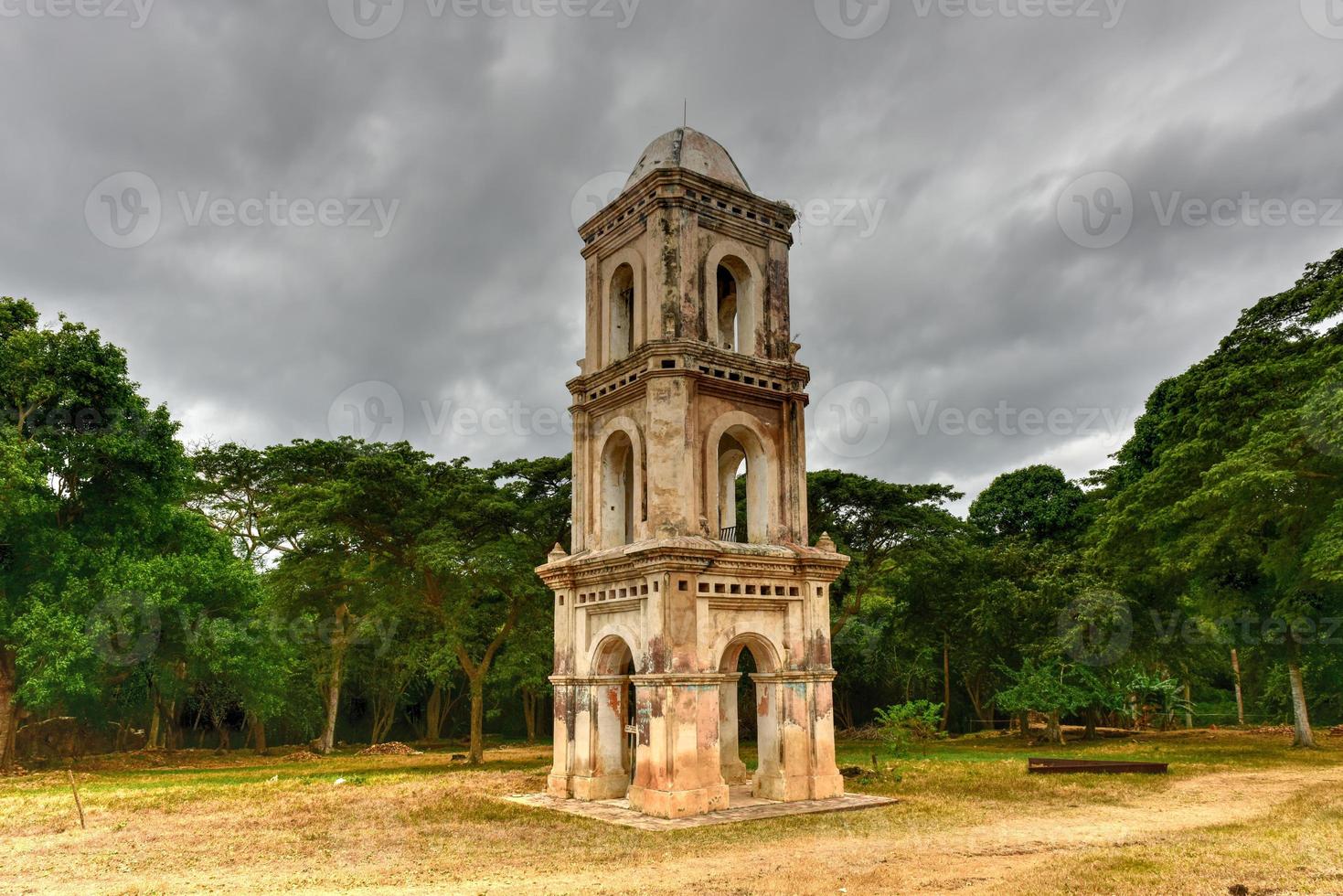 Ruins of the slave tower of the once grand sugar mill Ingenio San Isidro de Los Destiladeros in the Valle de los Ingenios, Trinidad, Cuba photo