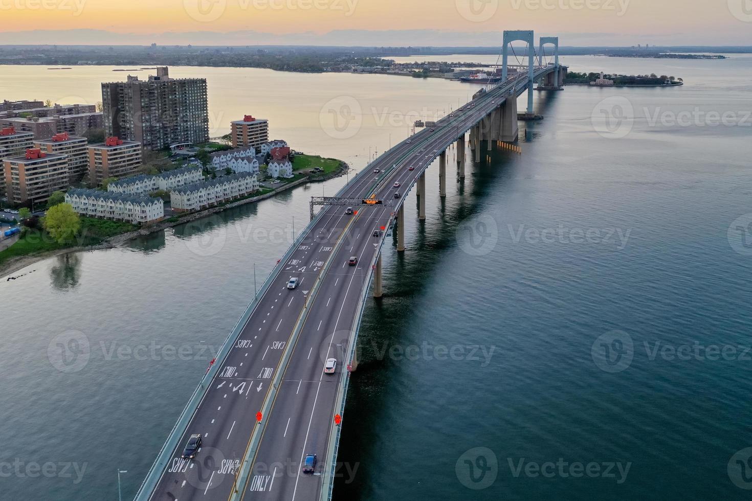 Aerial view of the Throgs Neck Bridge connecting the Bronx with Queens in New York City at sunset. photo