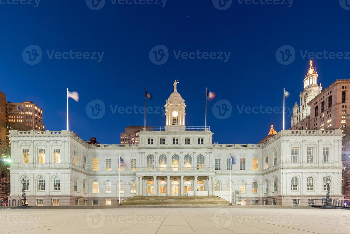 New York City Hall at night, the seat of New York City government, located at the center of City Hall Park in the Civic Center area of Lower Manhattan, between Broadway, Park Row, and Chambers Street. photo