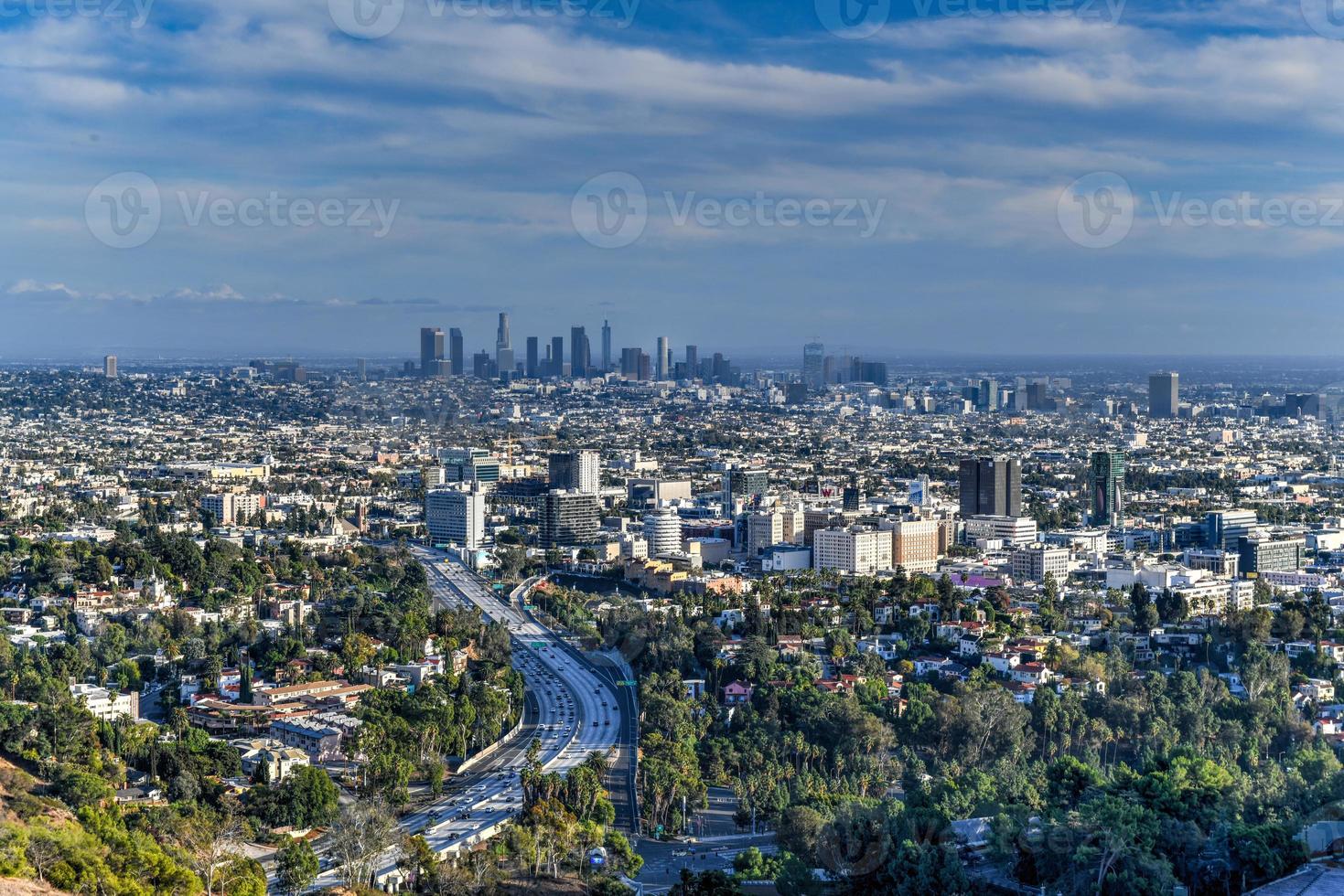 Downtown Los Angeles skyline over blue cloudy sky in California from Hollywood Hills. photo