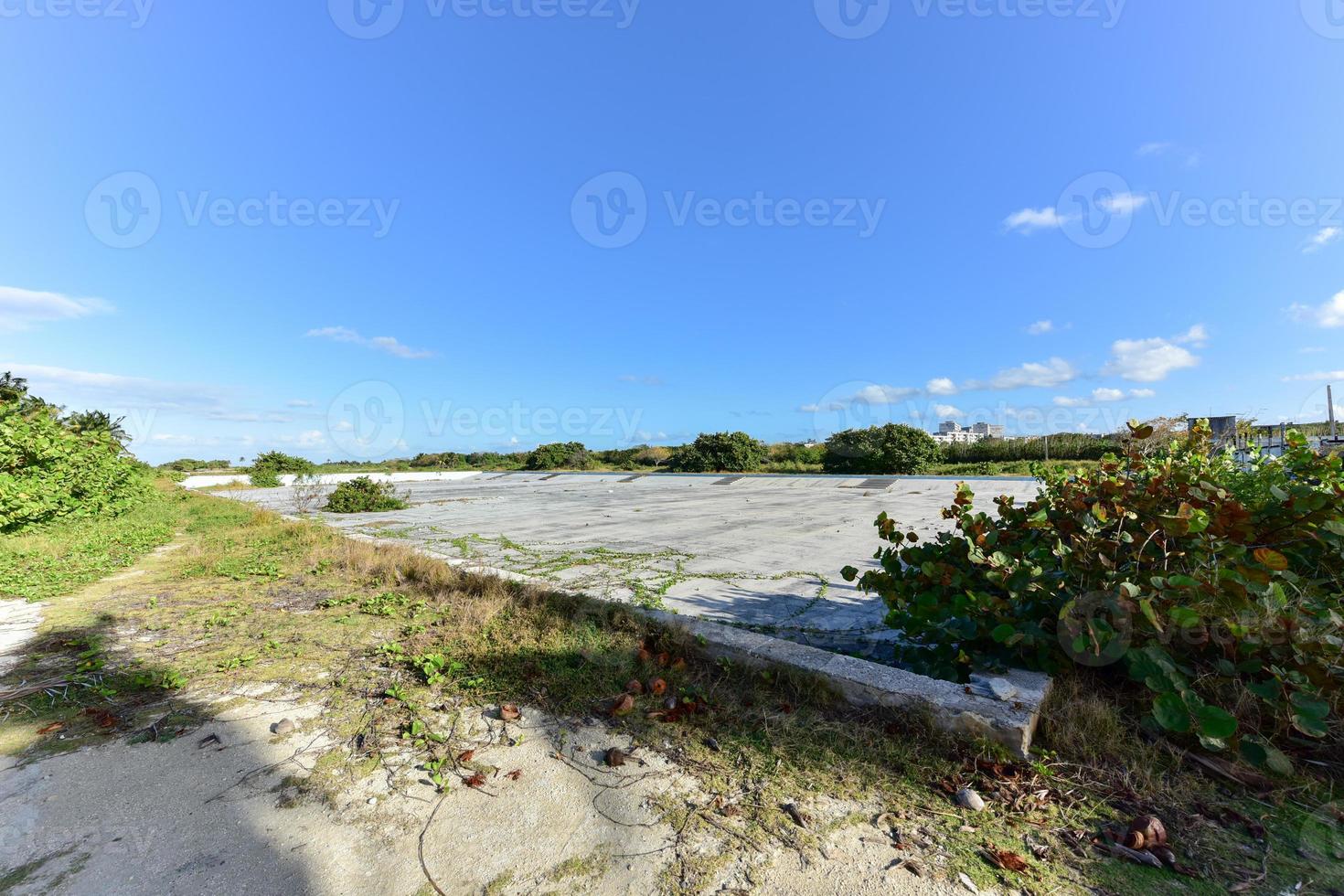 Old abandoned pool in Alamar, a district in the eastern part of Havana in Cuba. This district is primarily prefabrication construction of Soviet-style architecture. photo