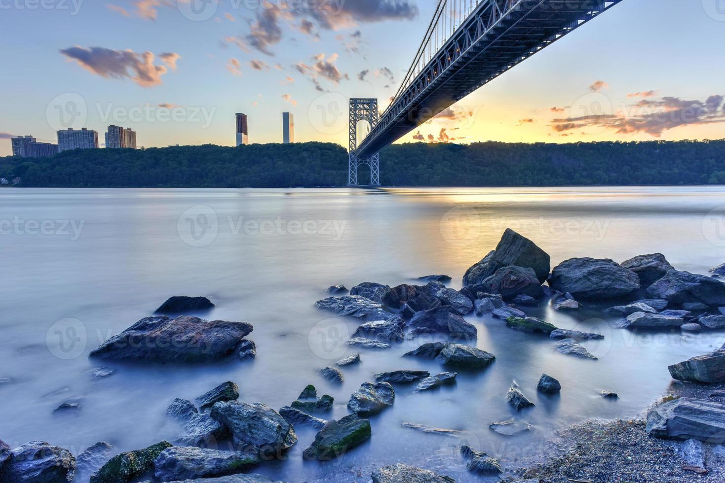 George Washington Bridge at sunset over the Hudson River from Manhattan. photo