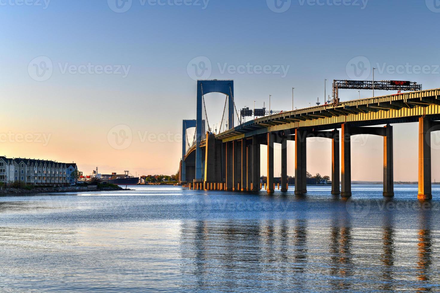 Aerial view of the Throgs Neck Bridge connecting the Bronx with Queens in New York City at sunset. photo