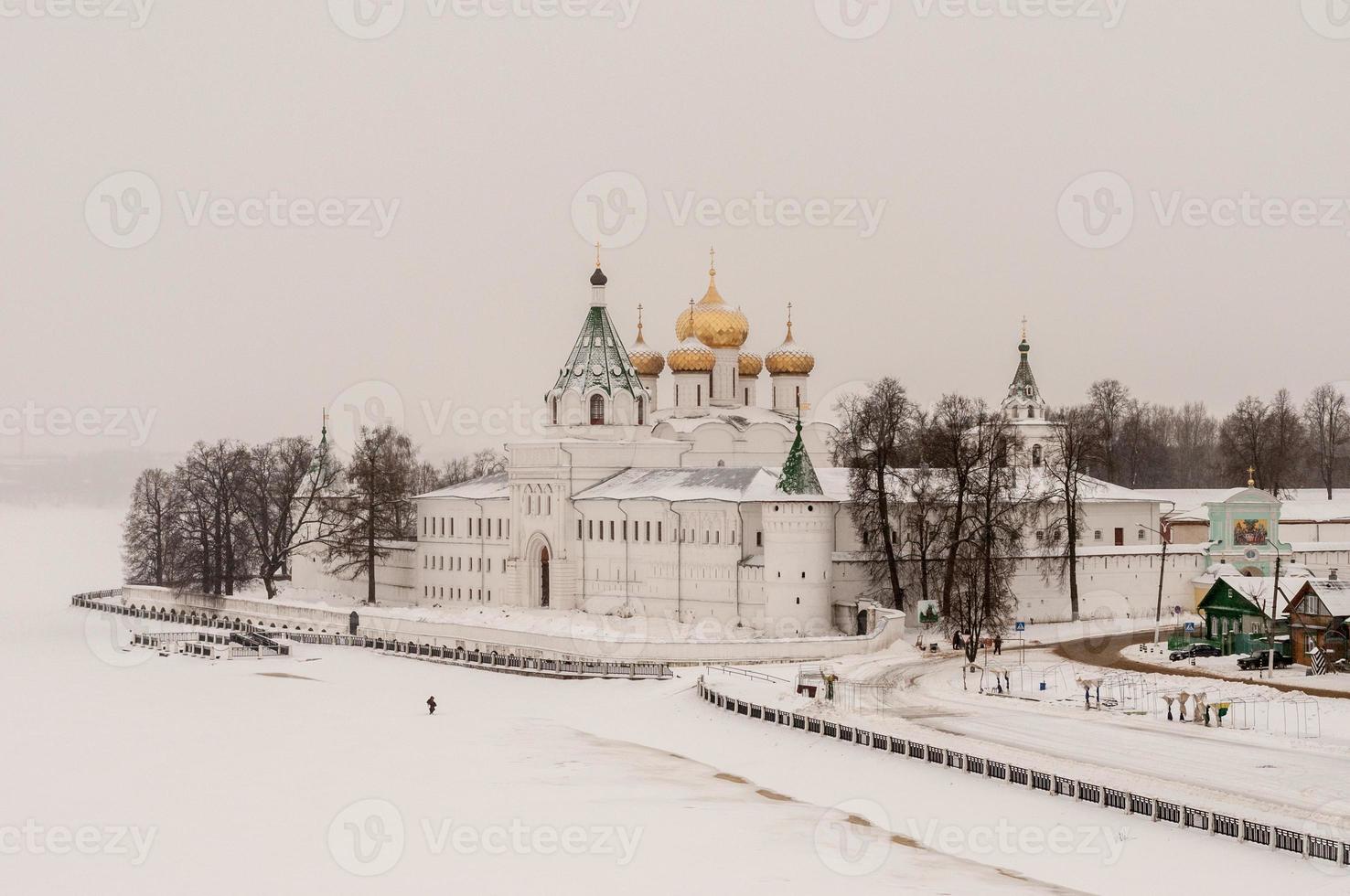 The Ipatiev Monastery, a male monastery, situated on the bank of the Kostroma River just opposite the city of Kostroma, Russia in the winter. photo