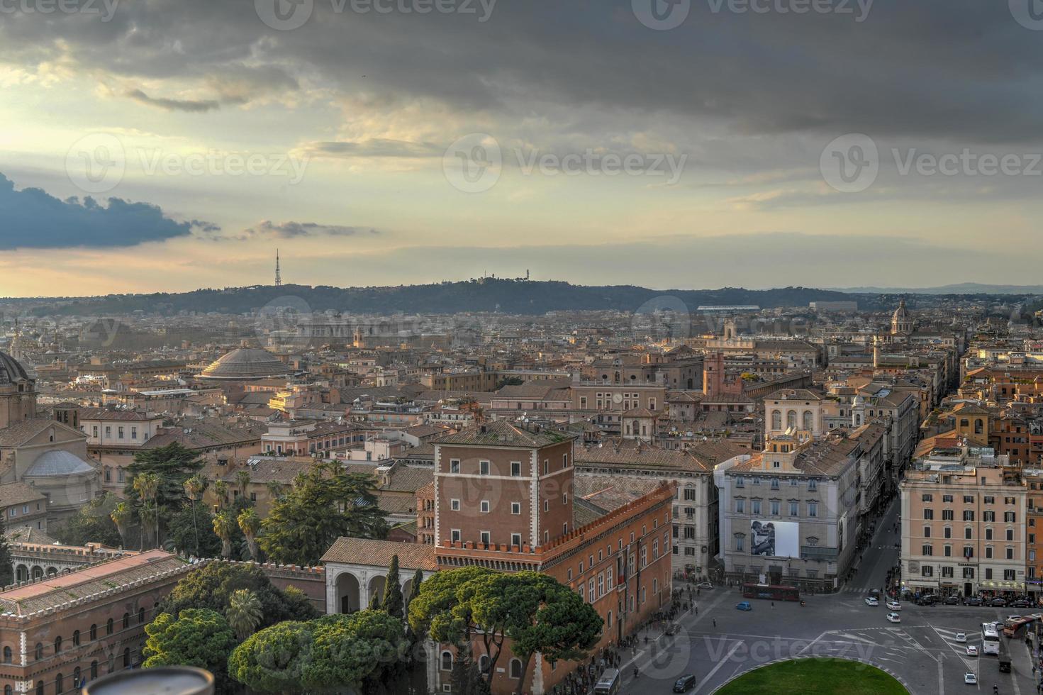 Aerial view of the skyline of Rome, Italy as sunset approaches. photo