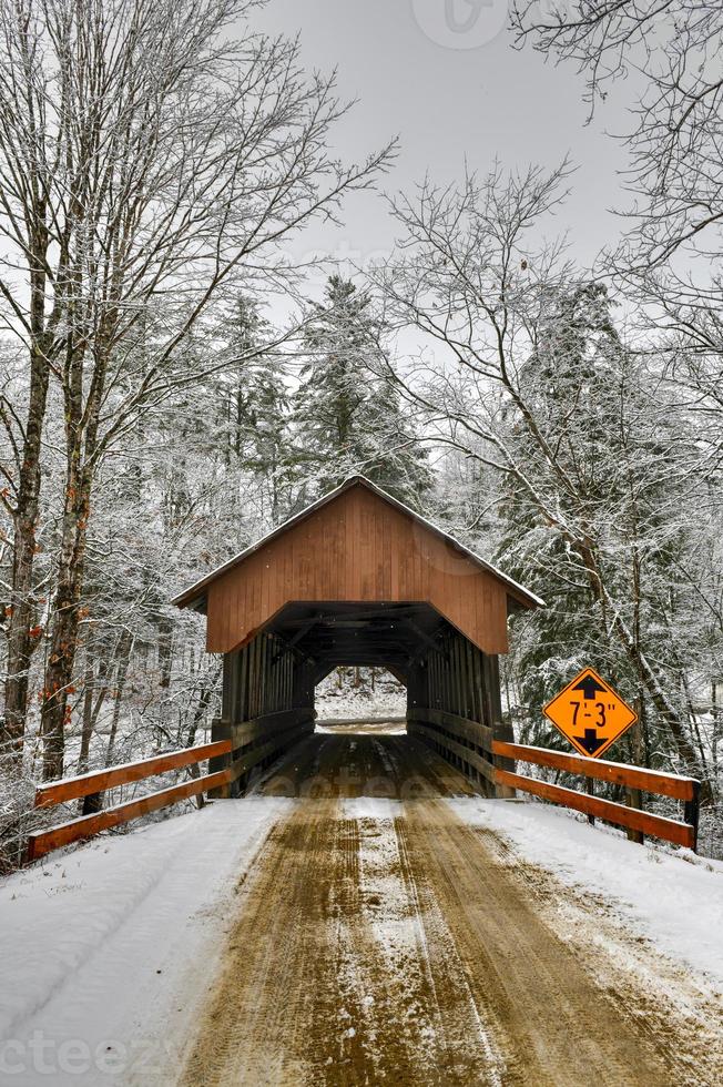 Dingleton Hill Covered Bridge in Cornish, New Hampshire during the winter. photo