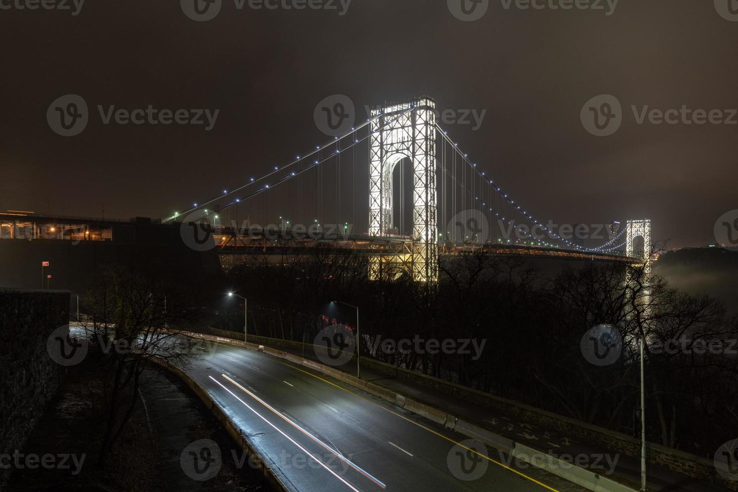 George Washington Bridge fully illuminated at night from New York City photo