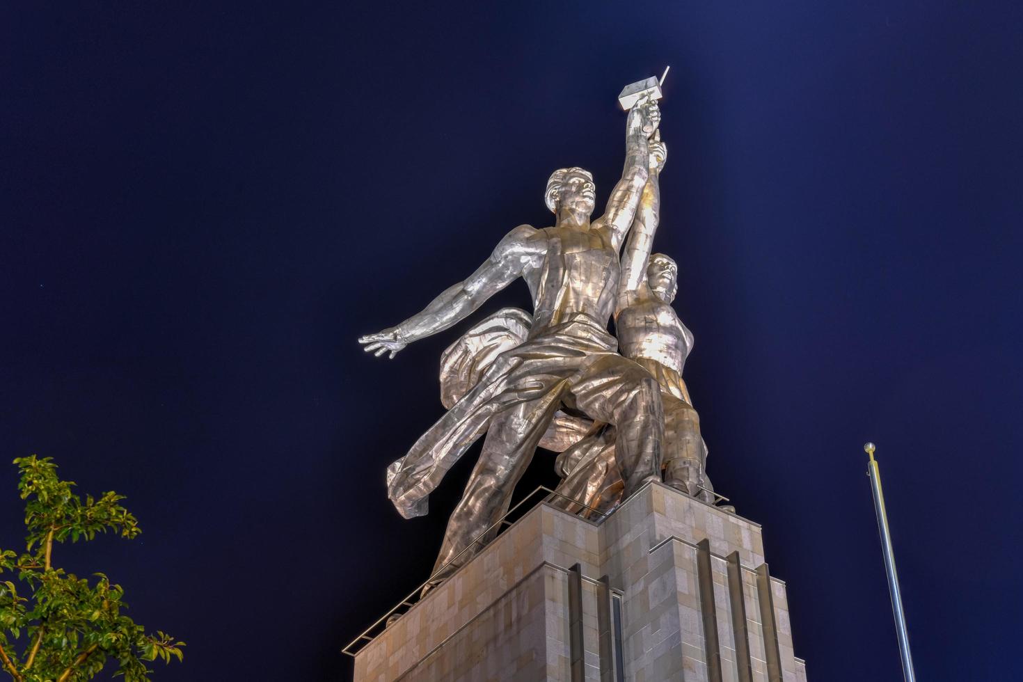 Moscow, Russia - July 22, 2019 -  Famous Soviet monument of the Worker and Kolkhoz Woman by sculptor Vera Mukhina at night. Made of stainless steel in 1937. photo