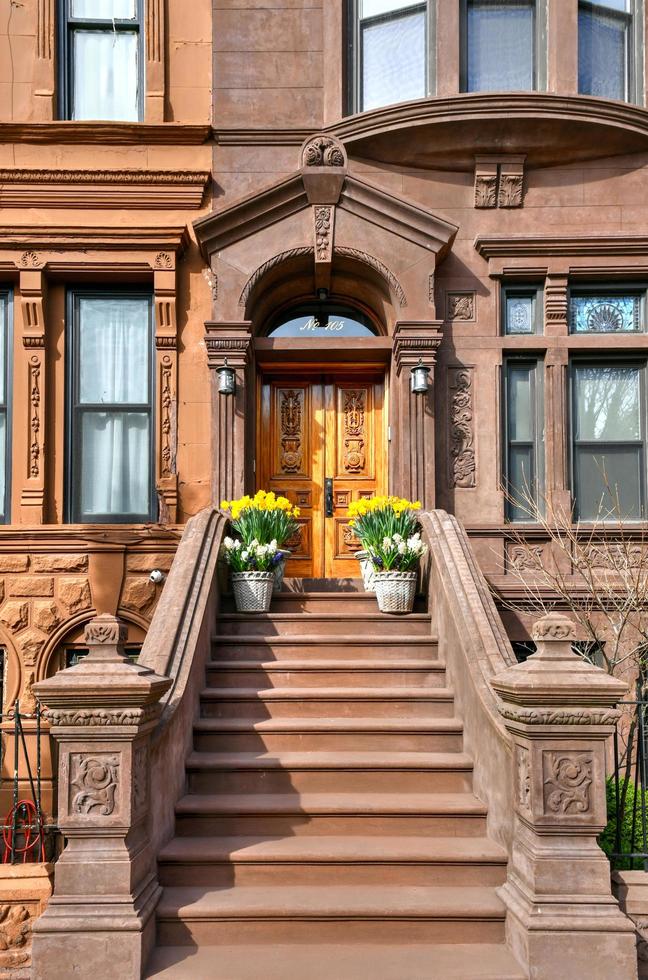 New York City - Apr 10, 2021 -  View of Brownstone buildings in Harlem in Manhattan, New York City. photo