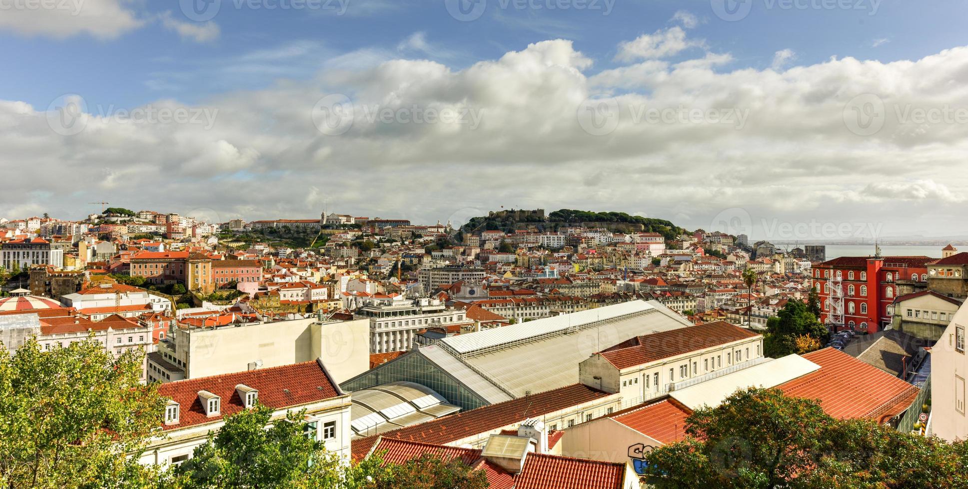 Panoramic view of old town Lisbon and Sao Jorge Castle from Garden of San Pedro de Alcantara, the capital and the largest city of Portugal. photo