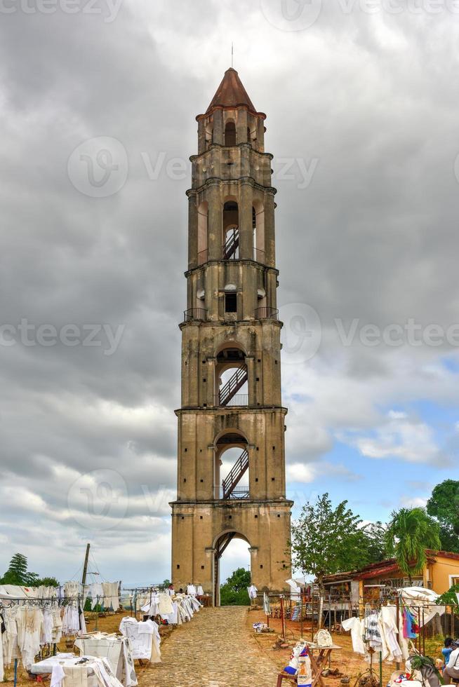 Historic slave watch tower in Manaca Iznaga, Valle de los Ingenios, Trinidad, Cuba. The Manaca Iznaga Tower is the tallest lookout tower ever built in the Caribbean sugar region. photo