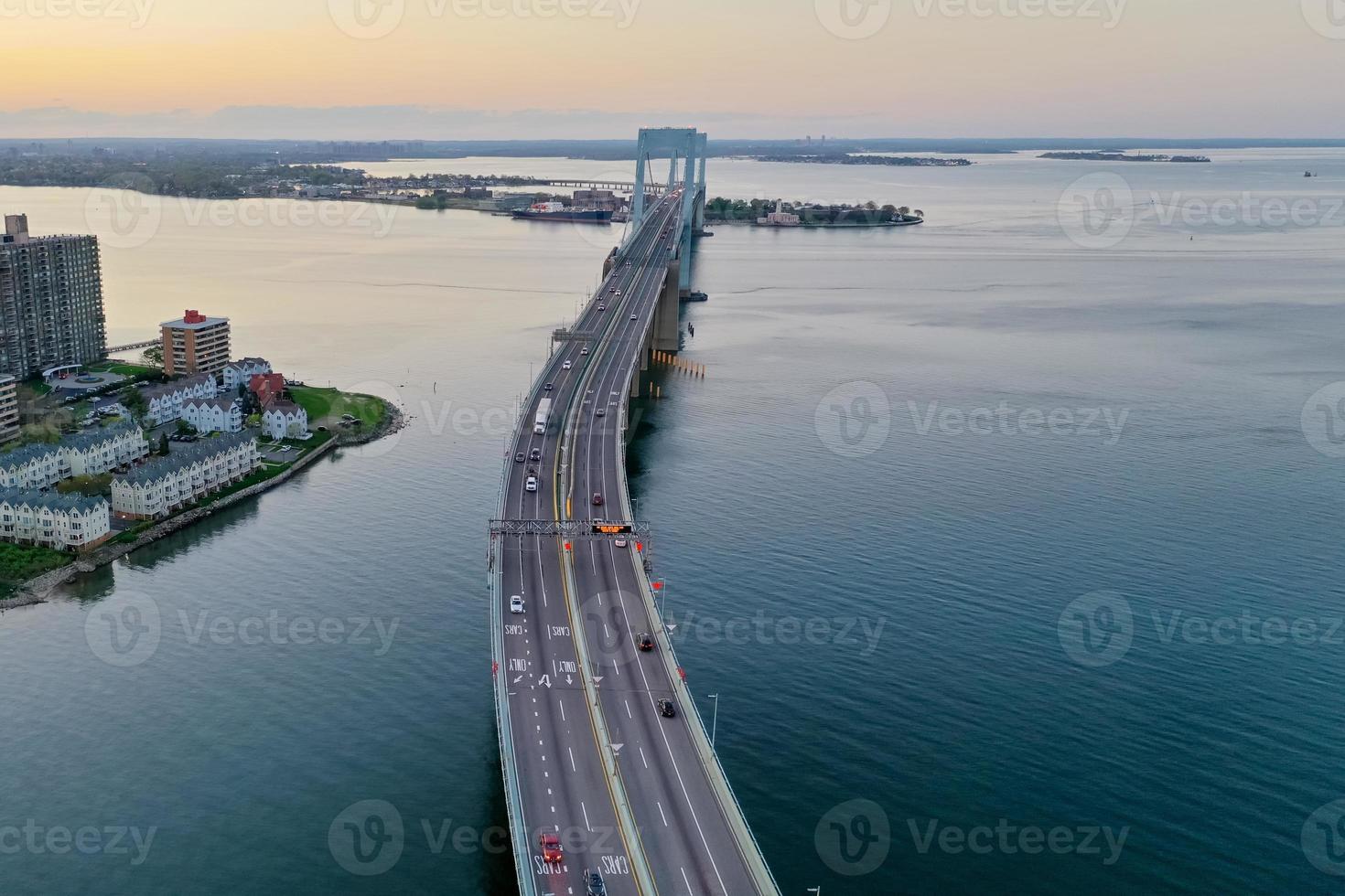 Aerial view of the Throgs Neck Bridge connecting the Bronx with Queens in New York City at sunset. photo