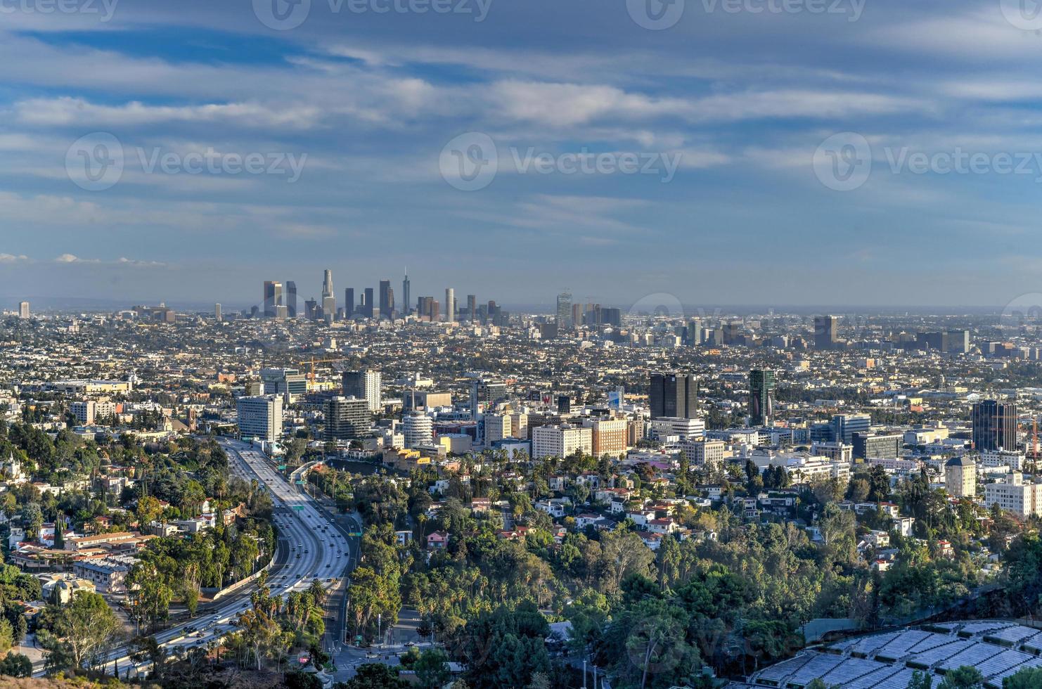 Downtown Los Angeles skyline over blue cloudy sky in California from Hollywood Hills. photo