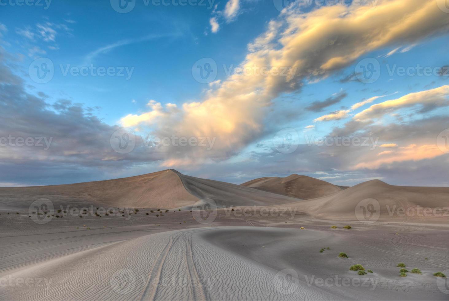 Sand Dunes along the Amargosa Desert at sunset photo