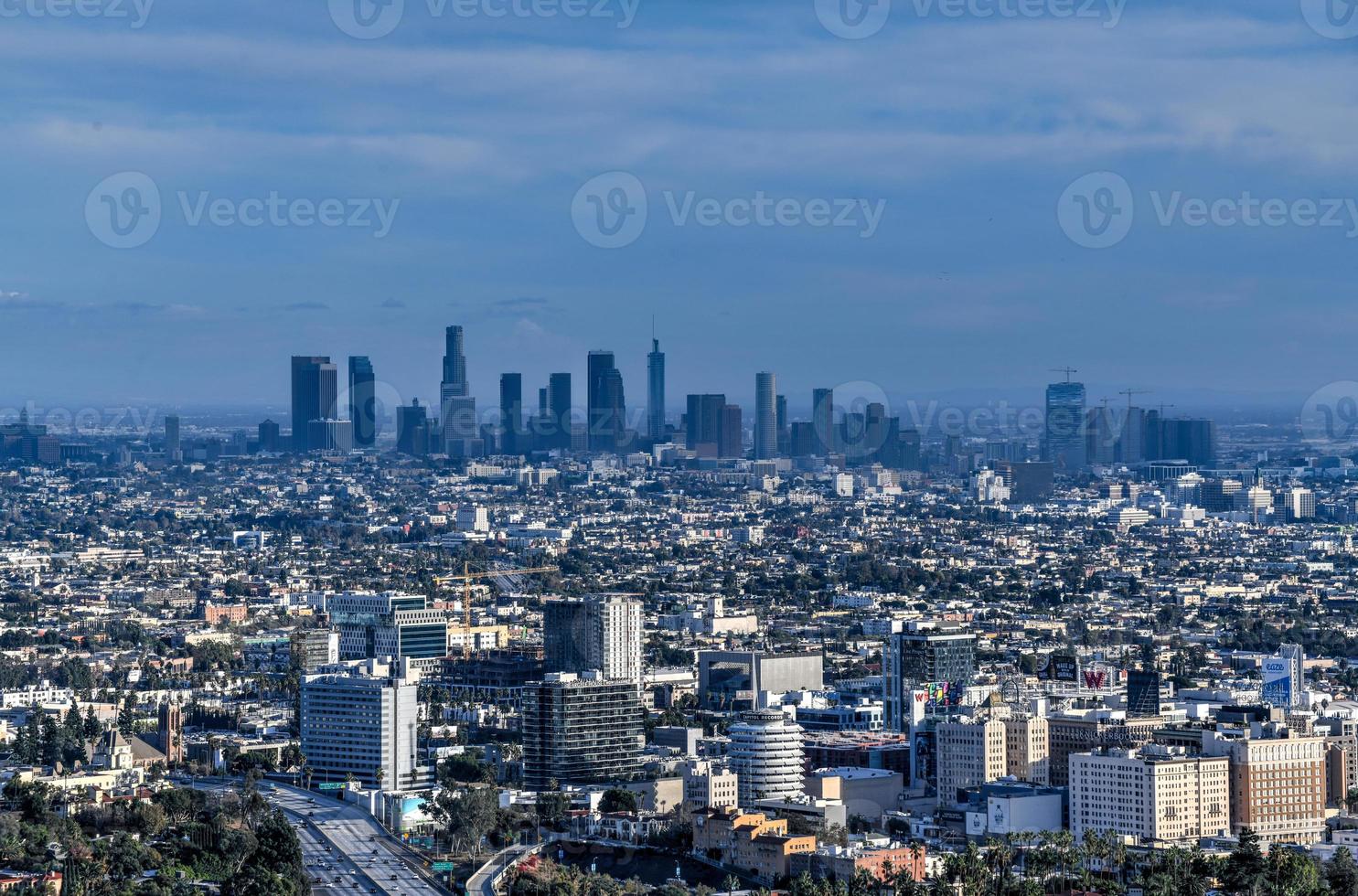 Downtown Los Angeles skyline over blue cloudy sky in California from Hollywood Hills. photo