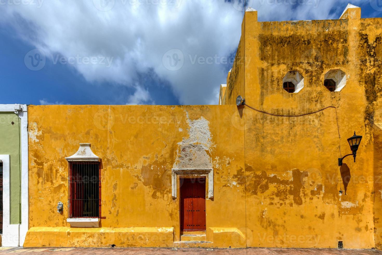 The beautiful yellow church of San Roque in the walled colonial city of Campeche, Mexico. photo