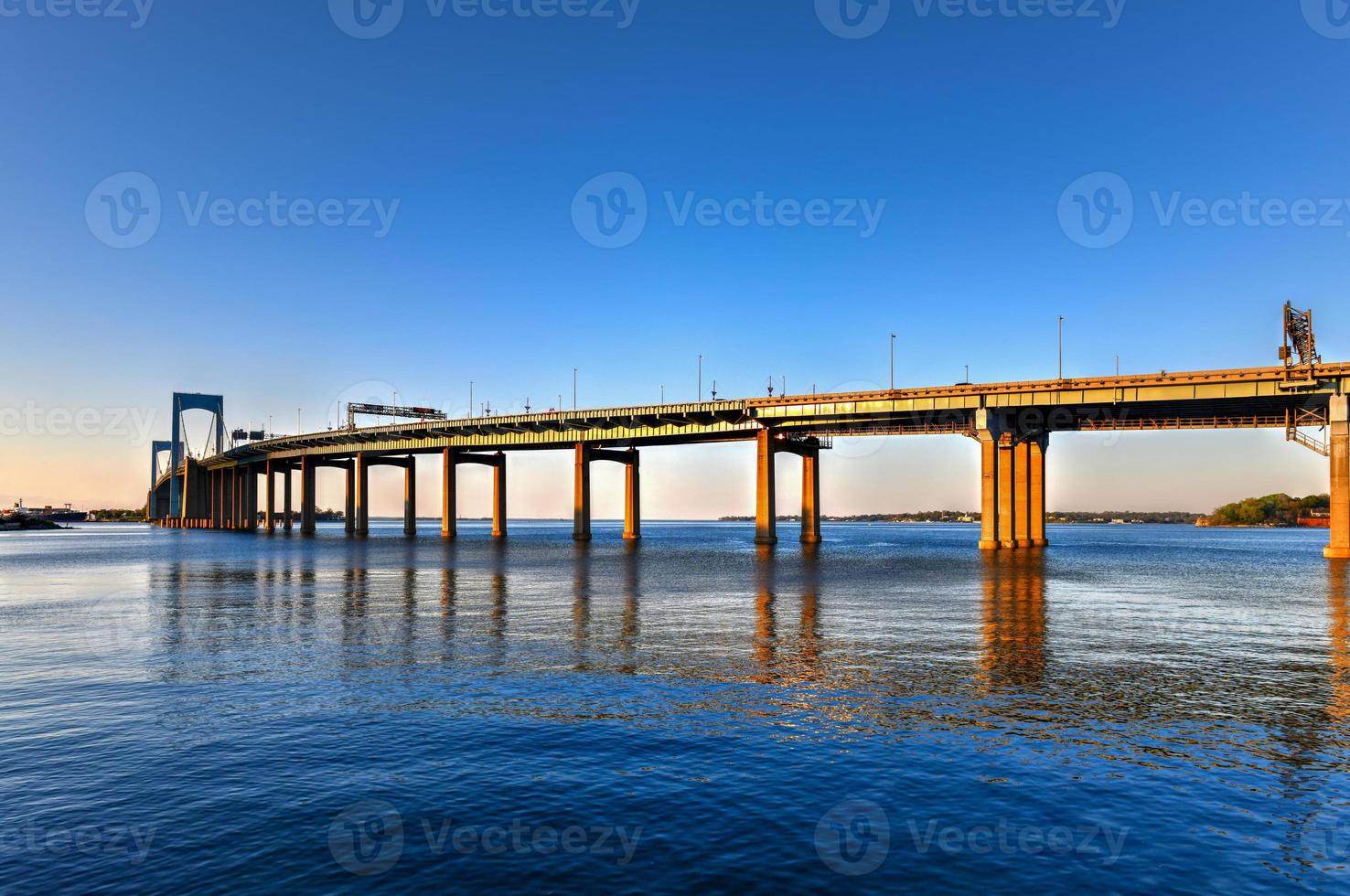 Aerial view of the Throgs Neck Bridge connecting the Bronx with Queens in New York City at sunset. photo