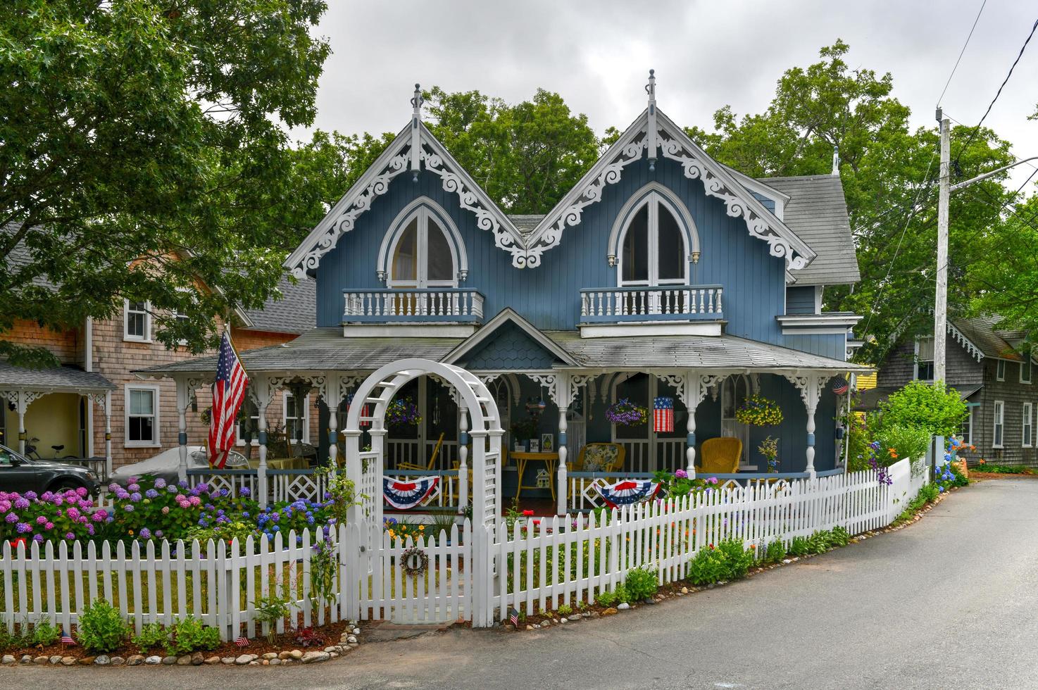 Martha's Vineyard, MA - July 5, 2020 -   Carpenter Gothic Cottages with Victorian style, gingerbread trim in Oak Bluffs on Martha's Vineyard, Massachusetts, USA. photo
