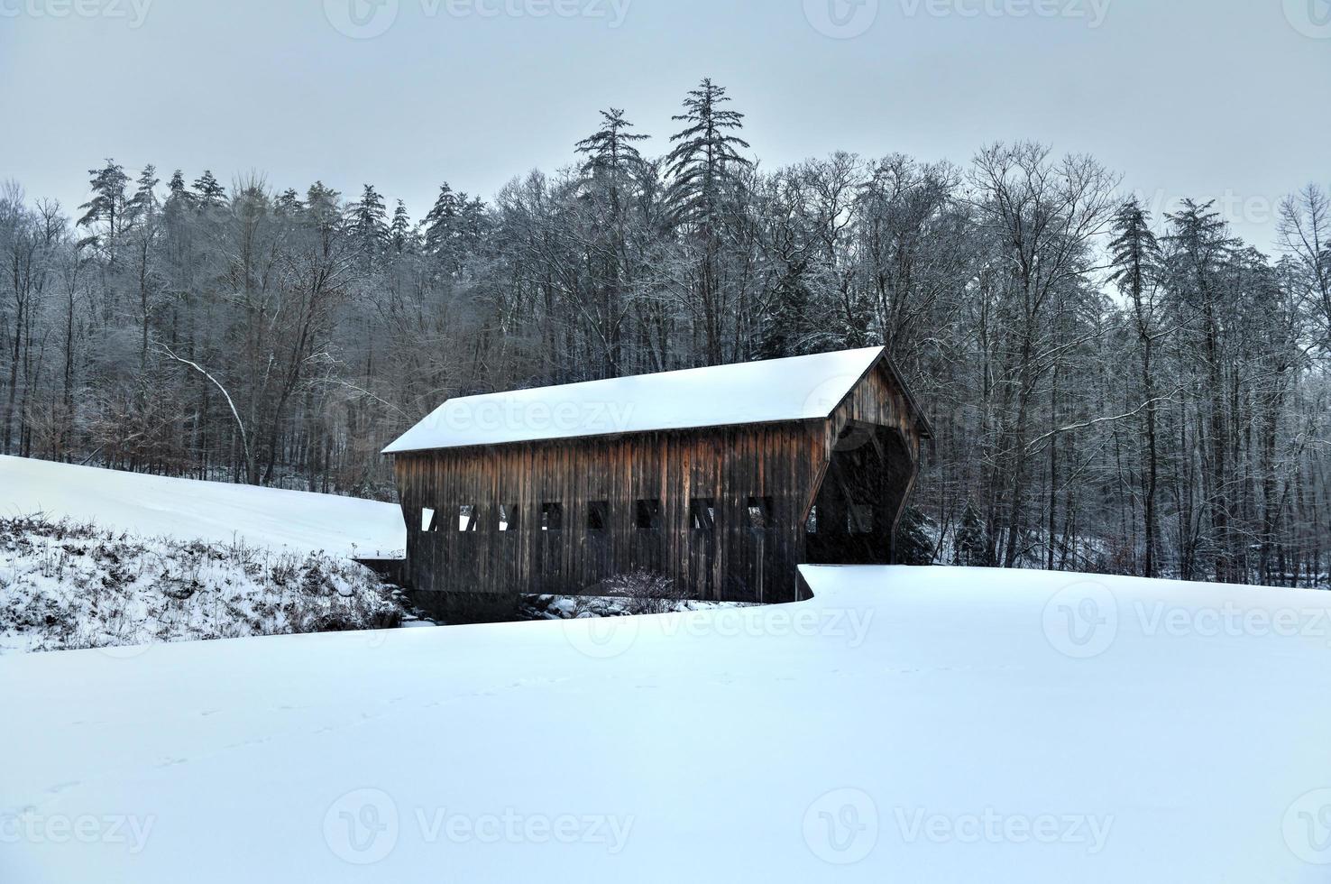 Mill Brook Covered Bridge in Reading, Vermont during the winter. photo