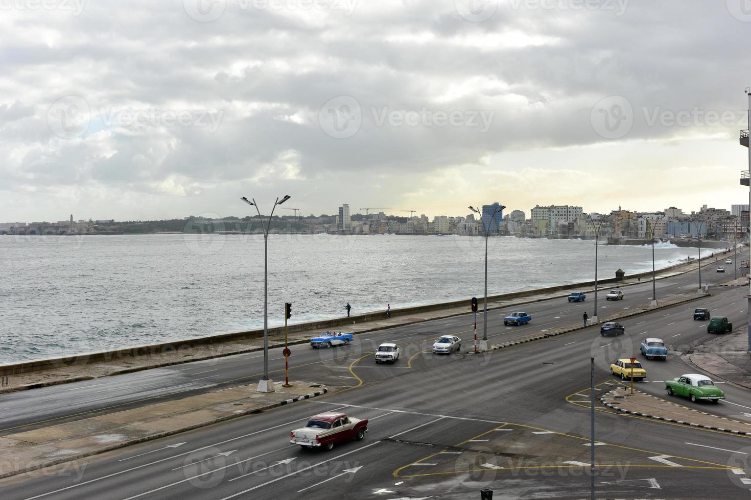 The Malecon in Havana. It is a broad esplanade, and seawall which for 8 km along the coast in Havana, Stock Photo at Vecteezy