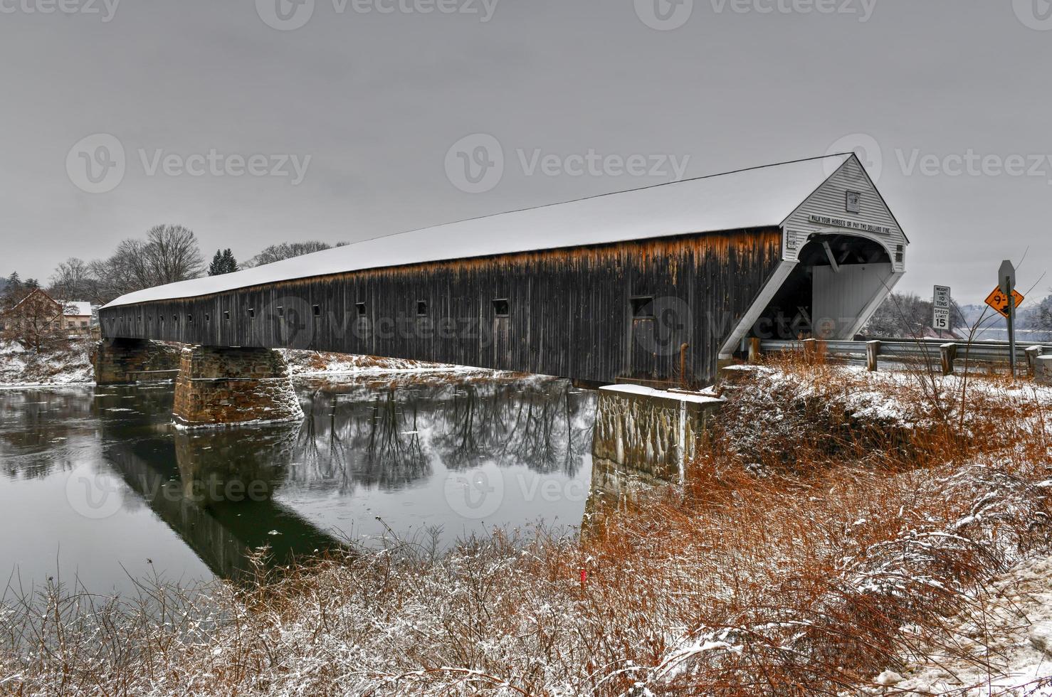 The Cornish-Windsor Covered Bridge. It connects Vermont and New Hampshire at their borders. It is the world's longest covered bridge at 460 feet. It was built in 1866. photo