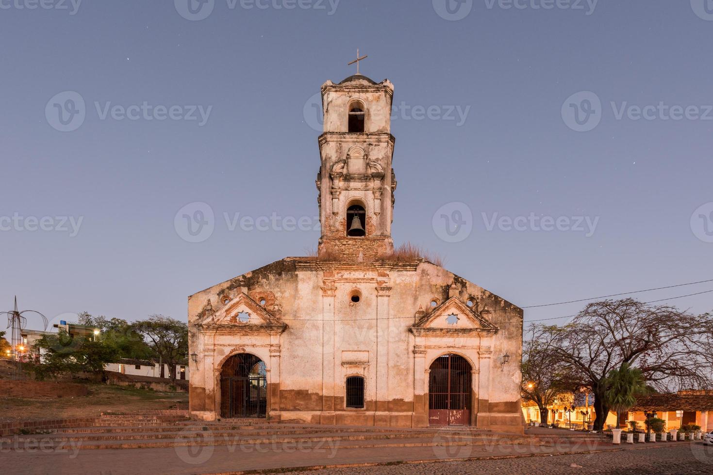 Ruins of the colonial catholic church of Santa Ana in Trinidad, Cuba at night. photo