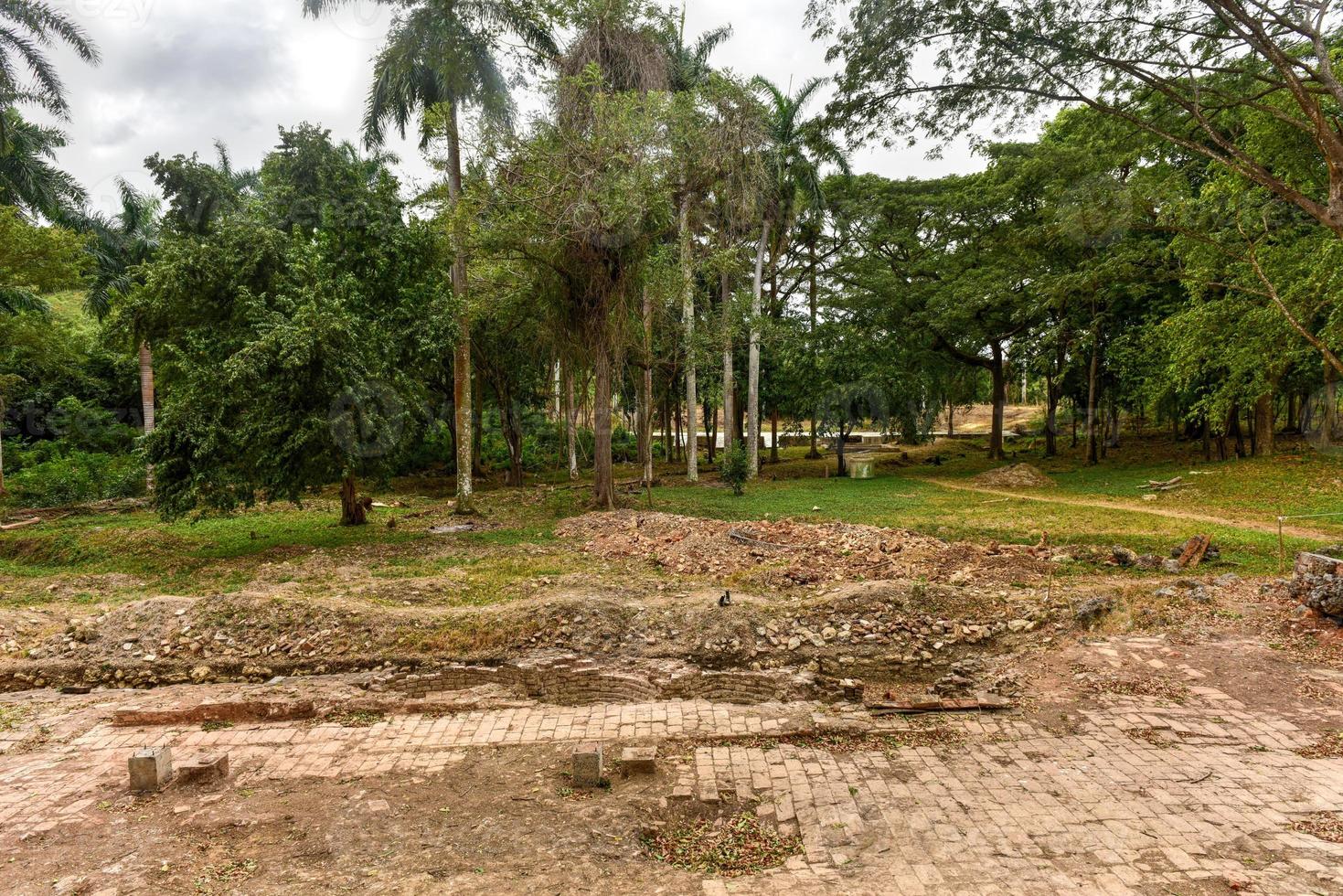 Ruins of the once grand sugar mill Ingenio San Isidro de Los Destiladeros in the Valle de los Ingenios, Trinidad, Cuba photo