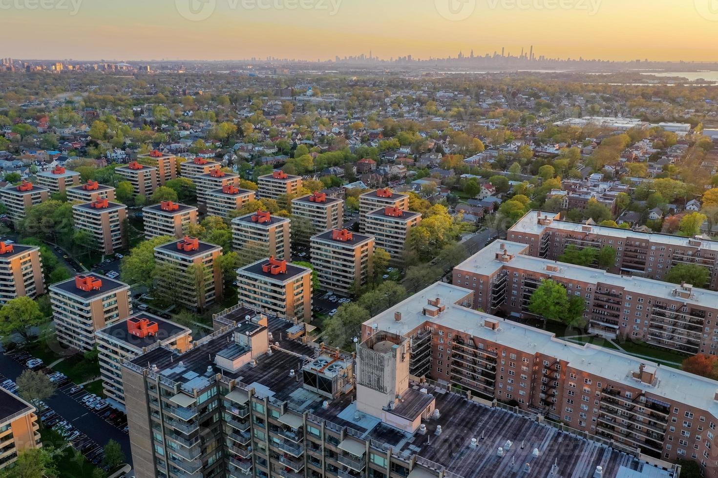 Aerial view of Queens in New York City at sunset with the George Washington Bridge in the background. photo