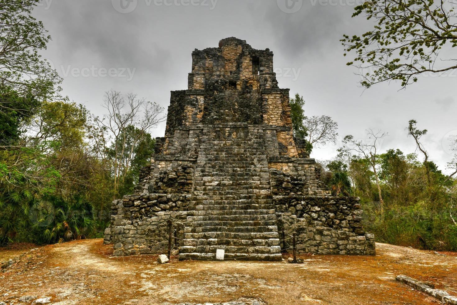 Muyil Mayan Ruins of a pyramid in Sian Kaan near Tulum, Mexico. photo