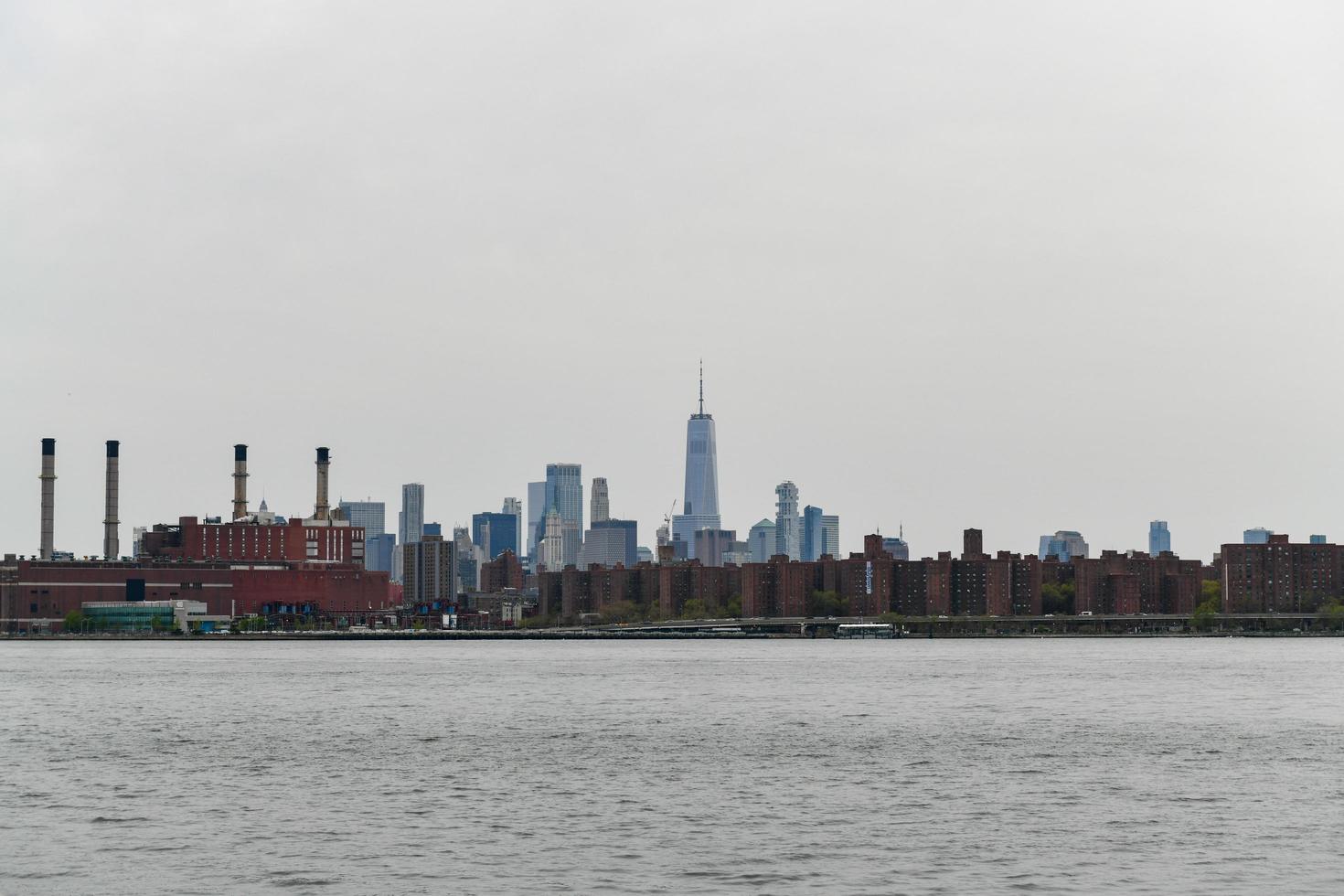 Brooklyn, New York - Apr 24, 2021 -  Downtown New York City skyline from Transmitter Park in Greenpoint, Brooklyn. photo