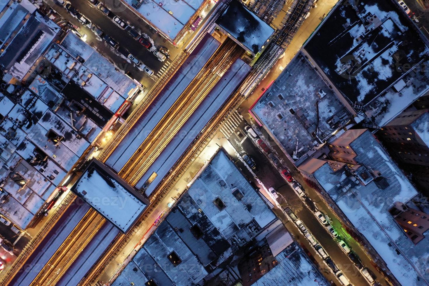 Aerial top-down view of elevated subway tracks in New York City on a winter day. photo