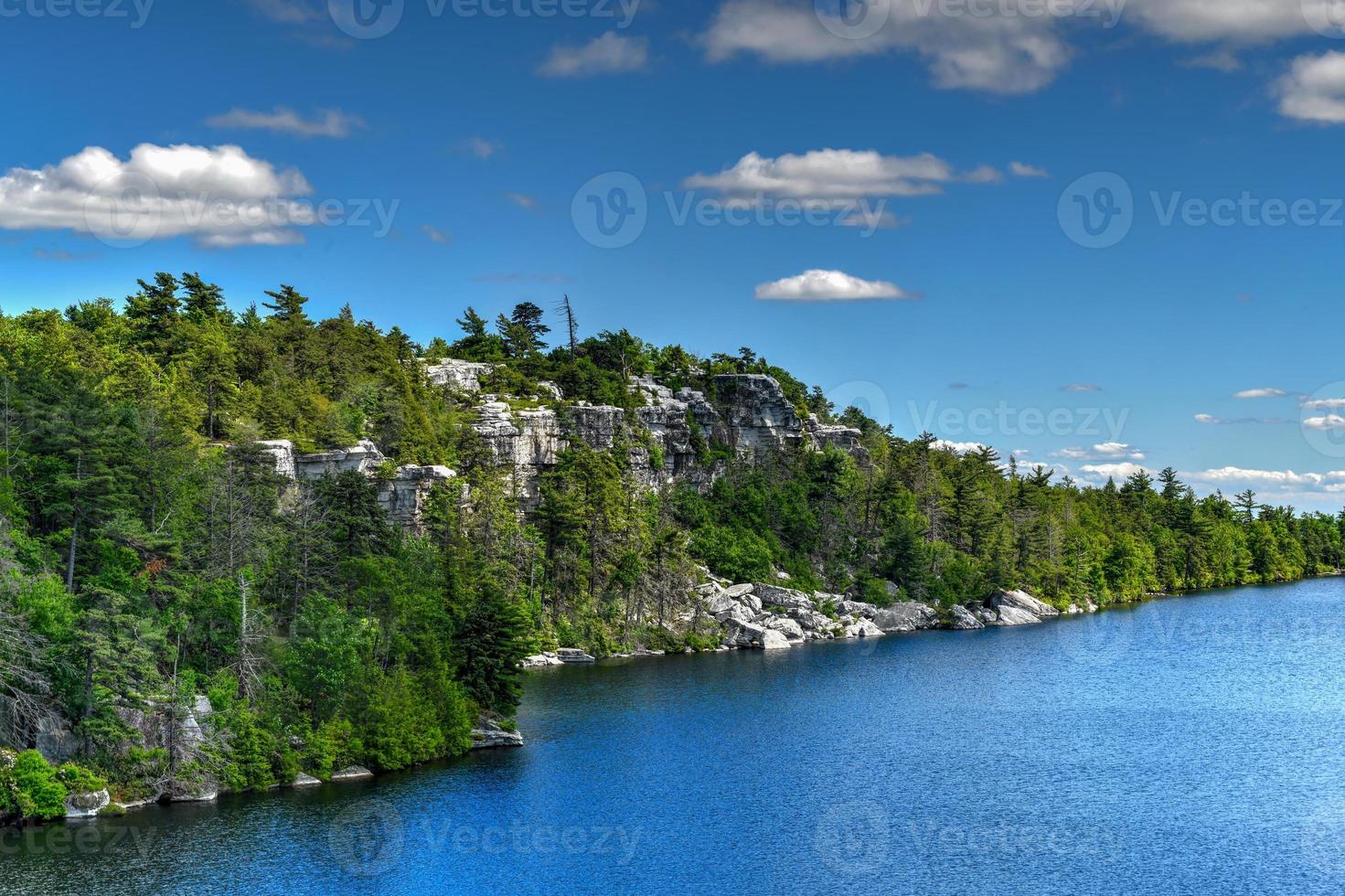 Massive rocks and view to the valley at Minnewaska State Park Reserve Upstate NY during summer time. photo