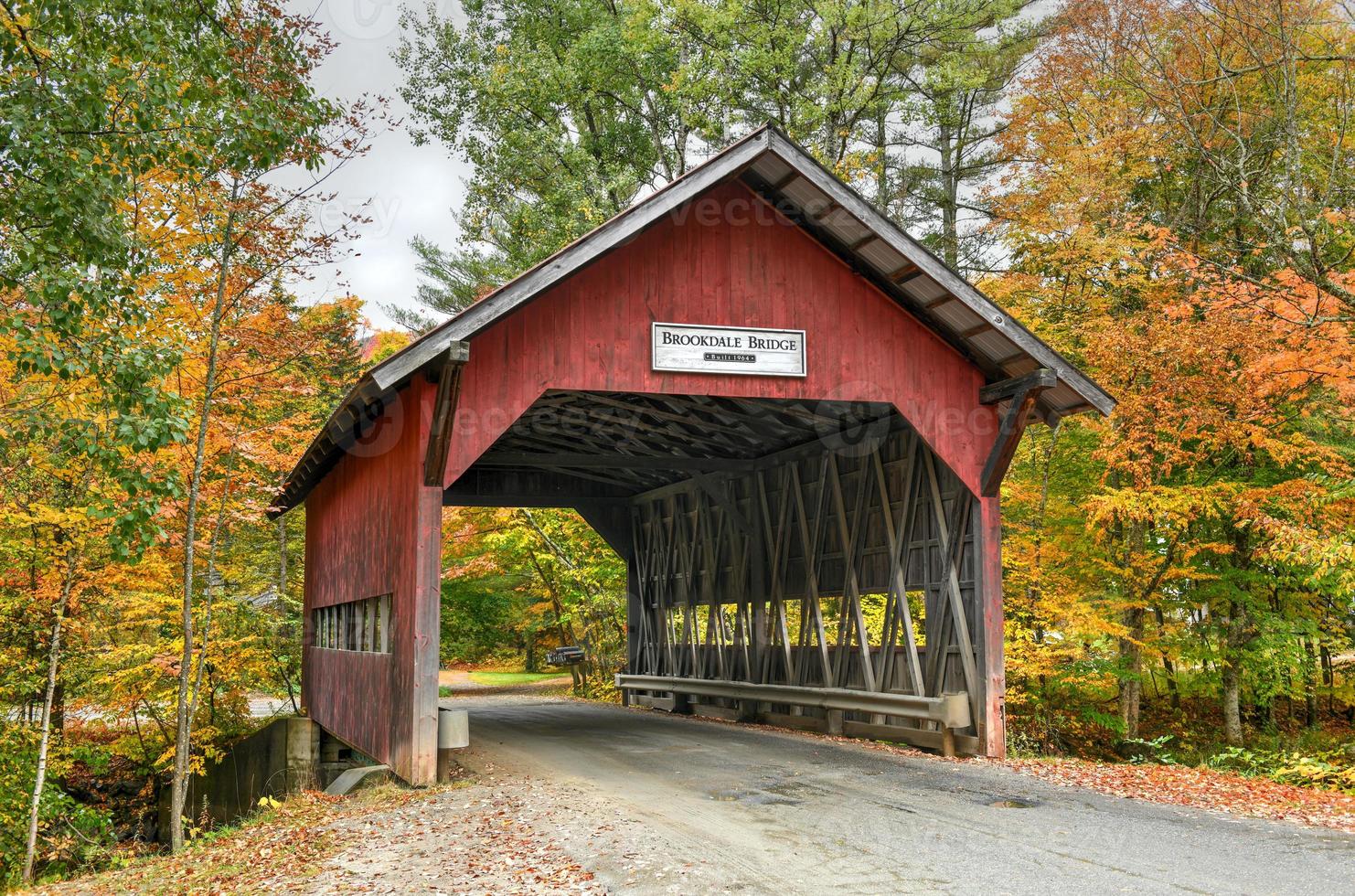 Brookdale Covered Bridge in Stowe, Vermont during fall foliage over the West Branch Little River