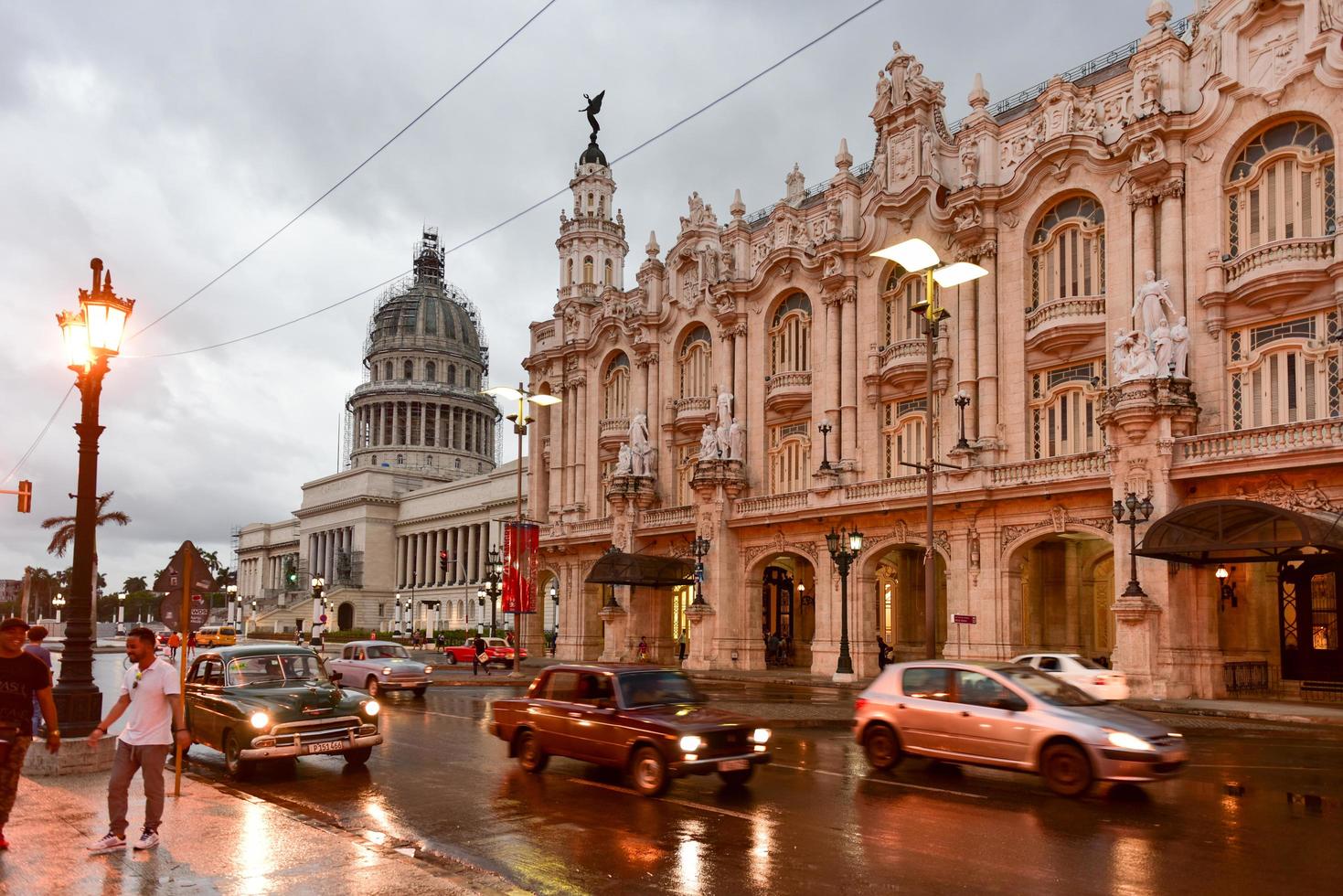 Havana, Cuba - January 7, 2017 -  Historic Hotel Inglaterra near the Central Park in Havana, Cuba with the Capitolio in the National Capital Building in the background. photo