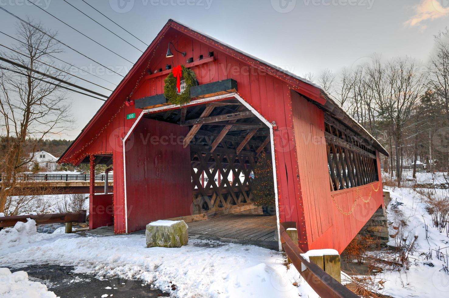 Creamery Covered Bridge in West Brattleboro, Vermont during the winter. photo