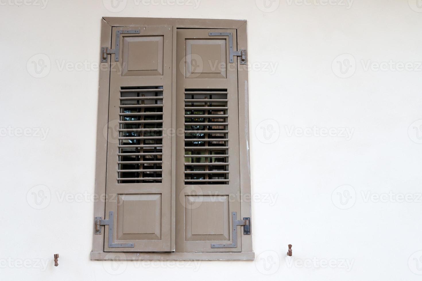 A small window in a residential building in a big city photo