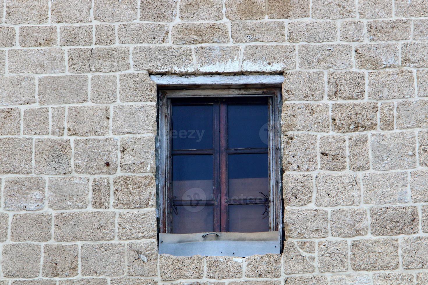 A small window in a residential building in a big city photo