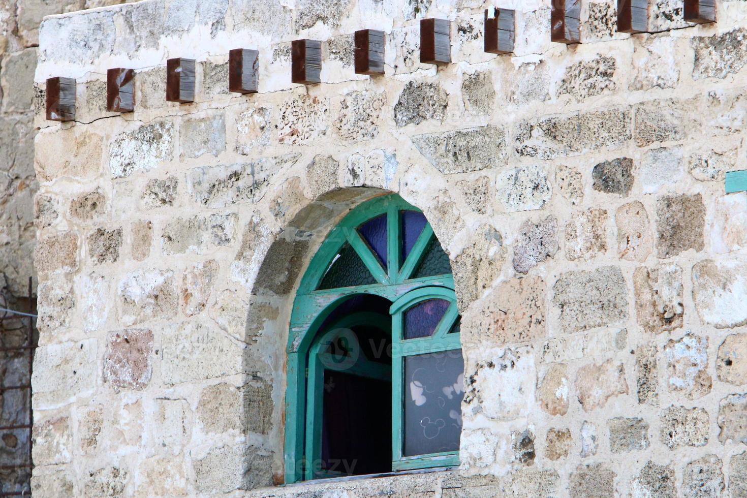 A small window in a residential building in a big city photo