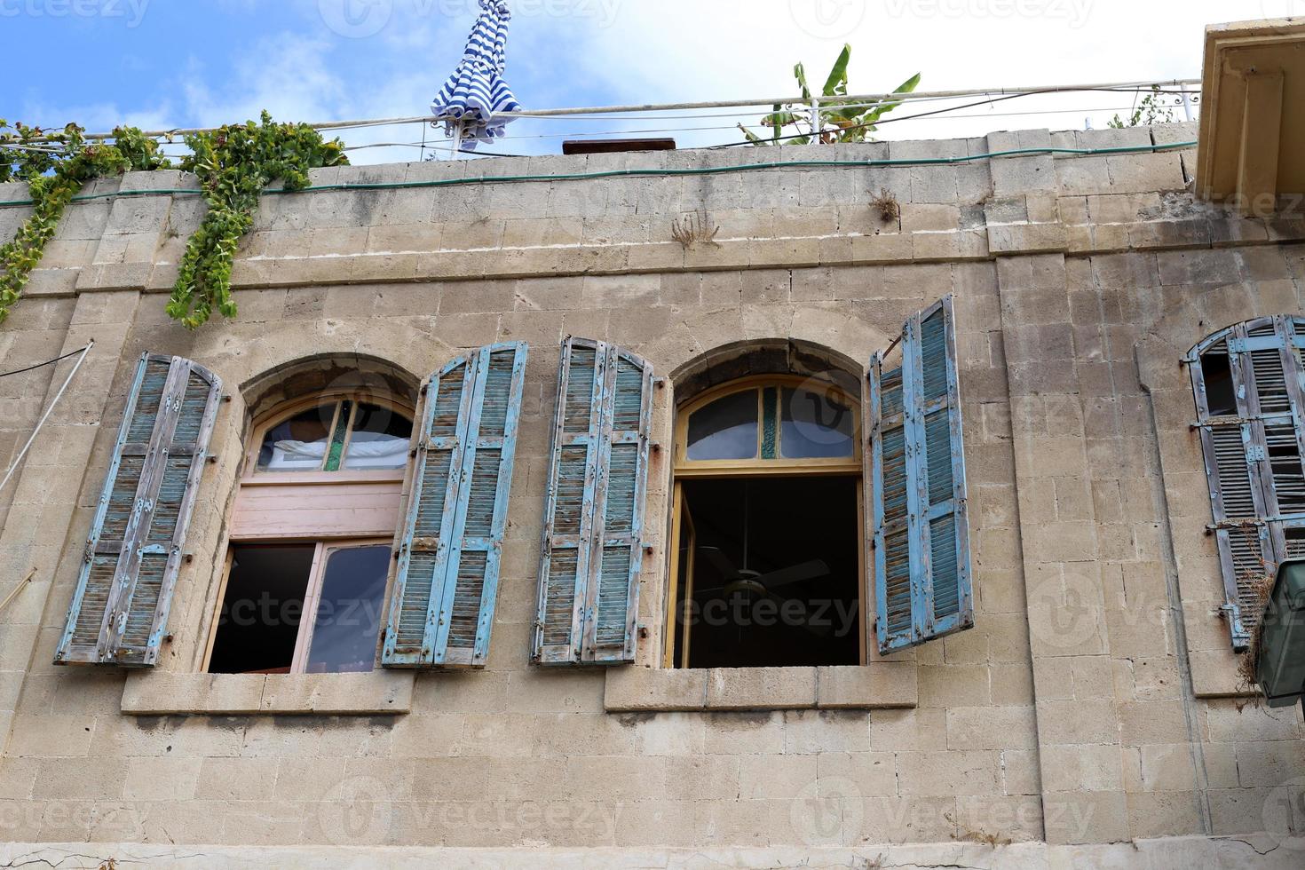 A small window in a residential building in a big city photo
